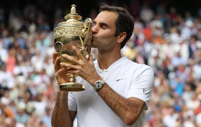 Swiss Roger Federer kisses the Wimbledon Singles trophy after victory over Croat Marin Cilic at the 2017 Wimbledon championships, London on July 16, 2017. Federer beat Cilic 6-3, 6-1, 6-4, to win his eighth Wimbledon Men&#8217;s Singles Final. Photo by /UPI, Image: 342059842, License: Rights-managed, Restrictions: CAPTION CORRECTION, Model Release: no, Credit line: Profimedia, UPI