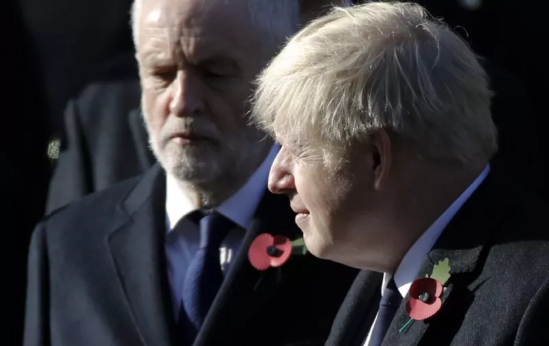 Britain's Prime Minister Boris Johnson (R) and Britain's Labour Party leader Jeremy Corbyn (L) take part in the Remembrance Sunday ceremony at the Cenotaph on Whitehall in central London, on November 10, 2019. - Remembrance Sunday is an annual commemoration held on the closest Sunday to Armistice Day, November 11, the anniversary of the end of the First World War and services across Commonwealth countries remember servicemen and women who have fallen in the line of duty since WWI. (Photo by Tolga AKMEN / AFP)