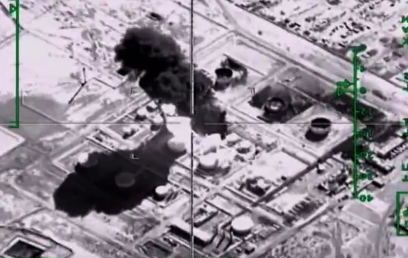 A video grab made on November 18, 2015, shows an image taken from a footage made available on the Russian Defence Ministry's official website on November 18, 2015, purporting to show an explosion after airstrikes carried out by Russian air force on what Russia says was an Islamic State oil-processing facility at an unidentified location in Syria. AFP PHOTO / RUSSIAN DEFENCE MINISTRY
*RESTRICTED TO EDITORIAL USE - MANDATORY CREDIT " AFP PHOTO / RUSSIAN DEFENCE MINISTRY" - NO MARKETING NO ADVERTISING CAMPAIGNS - DISTRIBUTED AS A SERVICE TO CLIENTS*