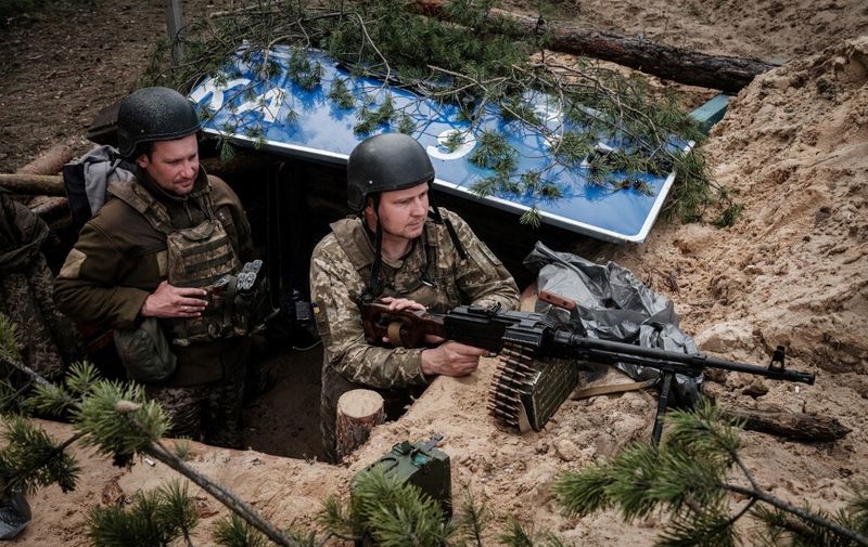 Ukrainian soldiers rest at their position near Lyman, eastern Ukraine, on April 28, 2022, amid Russian invasion of Ukraine. (Photo by Yasuyoshi CHIBA / AFP)