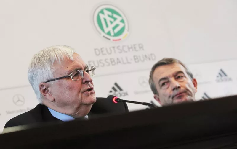 (FILES) A photo taken on December 7, 2011 shows Theo Zwanziger (L), then President of the German Football Federation (DFB) and Wolfgang Niersbach then DFB Secretary General at a press conference at the DFB headquarters in Frankfurt am Main, western Germany. Police raided offices of the German Football Federation (DFB) and homes of top officials on November 3, 2015 over tax evasion allegations, as a scandal surrounding graft claims over the awarding of the 2006 World Cup widened. The concerned officials are understood to be current DFB chief Wolfgang Niersbach, his predecessor Theo Zwanziger and ex-general secretary Horst Schmidt.
AFP PHOTO / DPA / FREDRIK VON ERICHSEN  +++ GERMANY OUT
