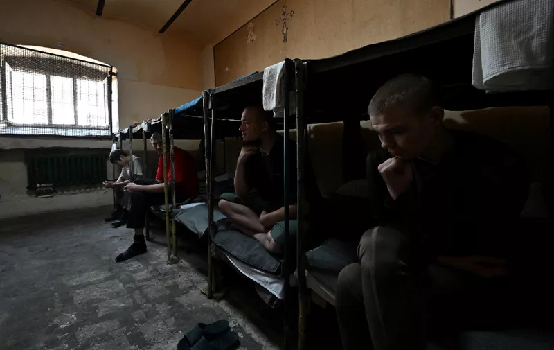 In this photograph taken on July 21, 2022, Russian prisoners of war sit in a cell at Lukyanivska Prison in Kyiv, amid the Russian invasion of Ukraine. Slumped against his metal bed frame in a detention centre in Ukraine's capital Kyiv, Sergeant Nikolai Matveev relives the ambush that made him one of the conflict's first prisoners of war.
The Russian soldier rests awkwardly on what remains of his left leg as he recounts how he was wounded -- the shock of shell fire, the searing pain, the hours crawling through frozen woodland desperate for help. The 36-year-old spoke after the Ukrainian authorities granted AFP's request for unconditional access to Russian prisoners. However it was impossible to verify if he was speaking freely or under duress. (Photo by Sergei SUPINSKY / AFP)