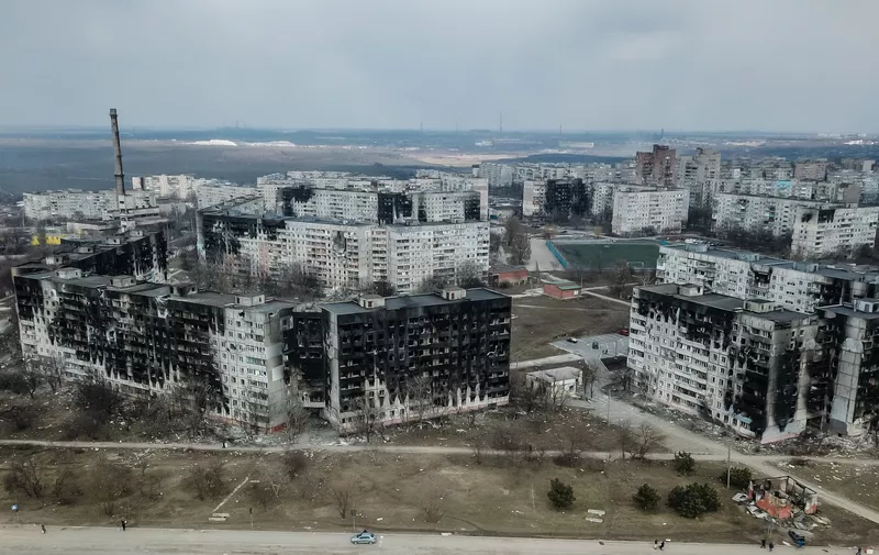 8144458 18.03.2022 An aerial views shows residential buildings damaged by shelling on the corner of Zaporozhskoe highway and Shevchenko boulevard in the city of Mariupol, Donetsk People's Republic. The city has been a site of intense fighting in recent weeks.,Image: 671720205, License: Rights-managed, Restrictions: Editors' note: THIS IMAGE IS PROVIDED BY RUSSIAN STATE-OWNED AGENCY SPUTNIK., Model Release: no, Credit line: Profimedia