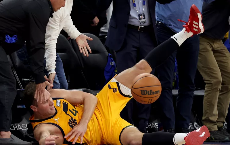 Utah Jazz forward Bojan Bogdanovic (44) dives for the ball against the Golden State Warriors during the second half of an NBA basketball game in San Francisco, Saturday, April 2, 2022. (AP Photo/Jed Jacobsohn)