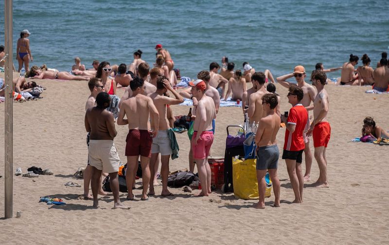 A group of tourists is seen exposed to the sun on the beach of Barceloneta. Barcelona reached a historic temperature record for the month of May. The thermometers touched 30 degrees Celsius, which encouraged residents and tourists to protect themselves from the sun or go to the beach areas to cool off.
Historic heat record in Barcelona, Spain - 22 May 2022,Image: 693761209, License: Rights-managed, Restrictions: , Model Release: no, Credit line: Profimedia