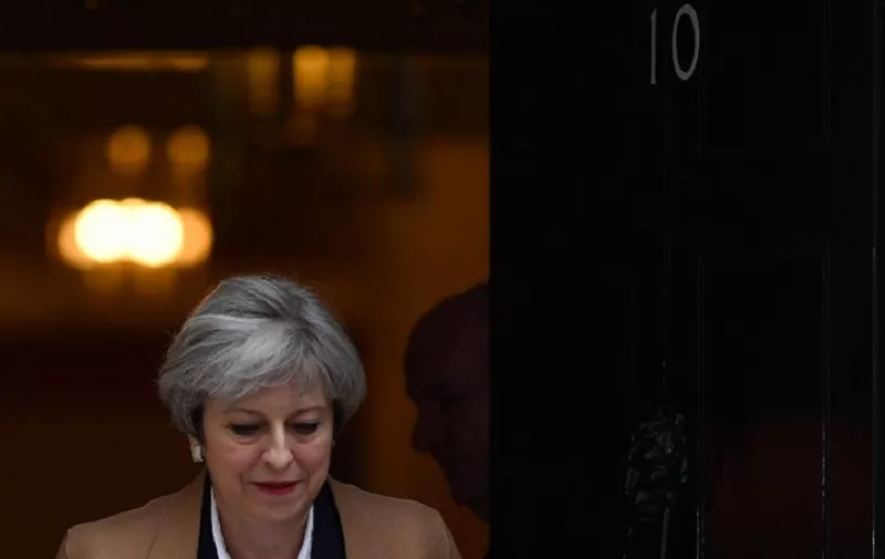 British Prime Minister Theresa May leaves 10 Downing Street before heading to the Houses of Parliament to attend the weekly Prime Minister's Questions (PMQs) in central London on March 29, 2017.
Britain formally launches the process for leaving the European Union on Wednesday, a historic step that has divided the country and thrown into question the future of the European unity project. / AFP PHOTO / Ben STANSALL