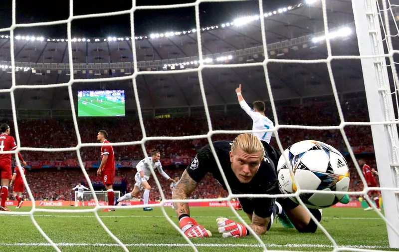 Liverpool goalkeeper Loris Karius looks on as he fails to save Real Madrids second goal, scored by Gareth Bale (centre floor) during the UEFA Champions League Final at the NSK Olimpiyskiy Stadium, Kiev., Image: 373046714, License: Rights-managed, Restrictions: , Model Release: no, Credit line: Profimedia, Press Association