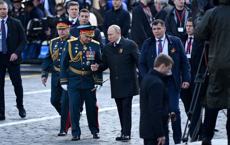 Russian President Vladimir Putin and Defence Minister Sergei Shoigu leave Red Square after the Victory Day military parade in central Moscow on May 9, 2022. - Russia celebrates the 77th anniversary of the victory over Nazi Germany during World War II. (Photo by Kirill KUDRYAVTSEV / AFP)