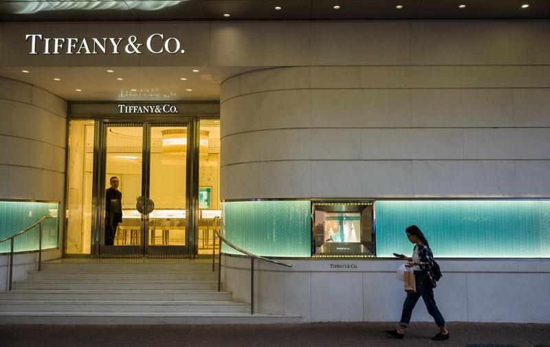 A pedestrian walks outside a shop of a US jewellers Tiffany &amp; Co shop on Russell Street in the popular shopping district of Causeway Bay in Hong Kong on October 30, 2019, a day before the citys third-quarter gross domestic product (GDP) figures are released. (Photo by Anthony WALLACE / AFP)