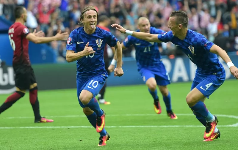 Croatia's midfielder Luka Modric (C) celebrates a goal during the Euro 2016 group D football match between Turkey and Croatia at Parc des Princes in Paris on June 12, 2016. (Photo by BULENT KILIC / AFP)