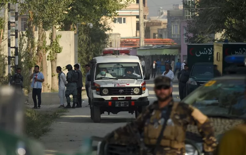 An ambulance is at hand as Afghan security personnel keep watch near the site following the militants' raid that targeted the elite American University of Afghanistan, in Kabul on August 25, 2016.

At least nine people were killed after militants stormed the American University of Afghanistan in Kabul, officials said, in a nearly 10-hour raid that prompted anguished pleas for help from trapped students. / AFP PHOTO / WAKIL KOHSAR