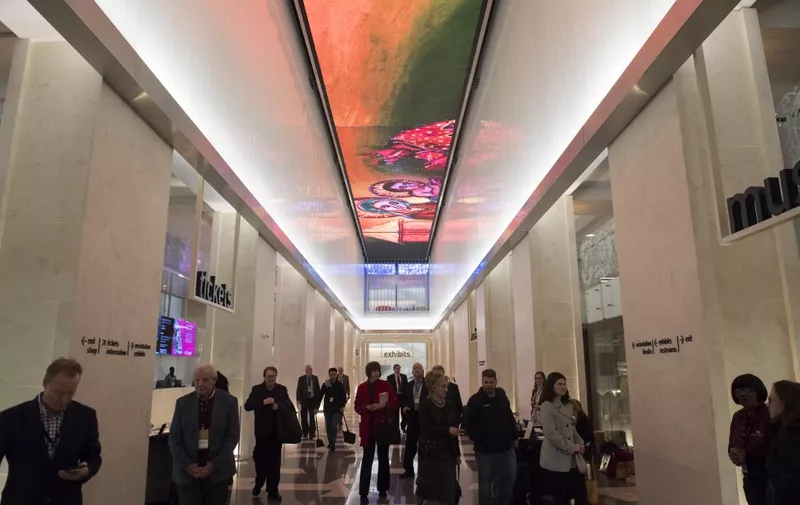 A digital screen is seen running the length of the museum lobby's ceiling during a media preview of the new Museum of the Bible, a 430,000 square-foot (39,948 square-meter) museum, dedicated to the history, narrative and impact of the Bible, in Washington, DC, November 14, 2017. (Photo by SAUL LOEB / AFP)