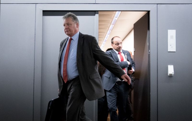 President of the German Federal Intelligence Agency (BND) Bruno Kahl (L) leaves after a meeting with members of the Parliamentary Control Panel (PKGr) on March 1, 2018 at the parliament in Berlin after Russian hackers have infiltrated Germany's foreign and interior ministries' online networks. - A cyberattack targeting Germany's government IT network is "ongoing", the parliamentary committee on intelligence issues said Thursday, without confirming a media report that Russian hackers were behind the assault. (Photo by Kay Nietfeld / DPA / AFP) / Germany OUT