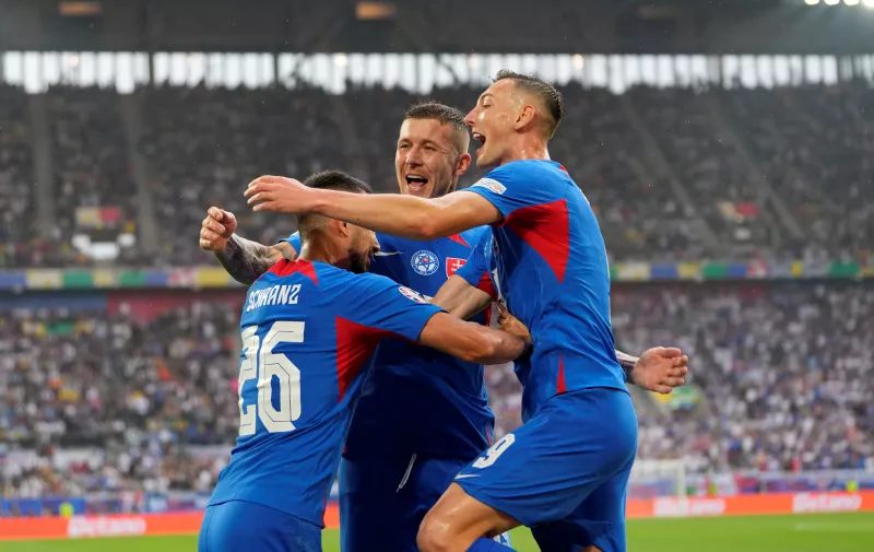 Slovakia's Ivan Schranz celebrates after scoring his side's opening goal during a Group E match between Slovakia and Ukraine at the Euro 2024 soccer tournament in Duesseldorf, Germany, Friday, June 21, 2024. (AP Photo/Andreea Alexandru)