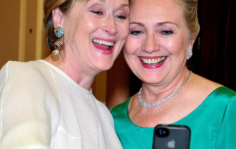 WASHINGTON, DC - DECEMBER 1:  Meryl Streep takes a photo of herself with U.S. Secretary of State Hillary Clinton following a dinner for Kennedy honorees hosted by U.S. Secretary of State Hillary Rodham Clinton at the U.S. Department of State on December 1, 2012 in Washington, DC. The 2012 honorees are Buddy Guy, actor Dustin Hoffman, late-night host David Letterman, dancer Natalia Makarova, and members of the British rock band Led Zeppelin Robert Plant, Jimmy Page, and John Paul Jones. (Photo by Ron Sachs - Pool/Getty Images)