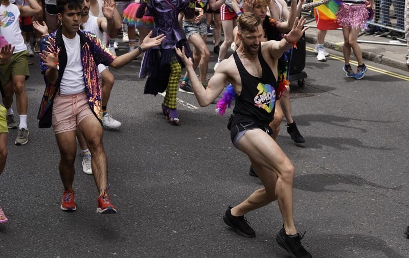 Members of the Lesbian, Gay, Bisexual and Transgender (LGBT+) community take part in the annual Pride Parade in the streets of Soho in London on July 2, 2022. (Photo by Niklas HALLE'N / AFP)