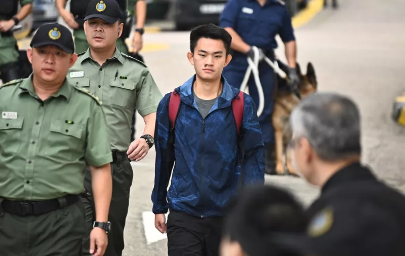 Chan Tong-kai, 20, wanted in Taiwan for the murder of his pregnant girlfriend during a holiday the two Hong Kongers took there in 2018, walks out the Pik Uk Prison in Hong Kong on October 23, 2019, after serving a short jail sentence for stealing his girlfriend's possessions. - Chan's case, where he fled back to Hong Kong where Taiwanese police were unable to apprehend him because there is no extradition agreement between the two territories, triggered an ill-fated proposal by Hong Kong's pro-Beijing government to ram through a sweeping extradition bill, which would have allowed the city to extradite suspects to any territory including the authoritarian mainland. (Photo by Philip FONG / AFP)