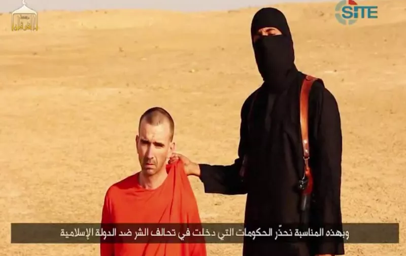 An image grab taken from a video released by the Islamic State (IS) and identified by private terrorism monitor SITE Intelligence Group on September 2, 2014 purportedly shows footage of a masked militant in a desert landscape threatening to kill British David Cawthorne Haines.  The so-called "Islamic State" released a video today showing the masked militant apparently beheading 31-year-old US freelance reporter Steven Sotloff and threatening to kill the British captive. AFP PHOTO / SITE INTELLIGENCE GROUP / HO  === RESTRICTED TO EDITORIAL USE - MANDATORY CREDIT "AFP PHOTO / HO / SITE INTELLIGENCE GROUP    - NO MARKETING NO ADVERTISING CAMPAIGNS - DISTRIBUTED AS A SERVICE TO CLIENTS FROM ALTERNATIVE SOURCES, AFP IS NOT RESPONSIBLE FOR ANY DIGITAL ALTERATIONS TO THE PICTURE'S ===