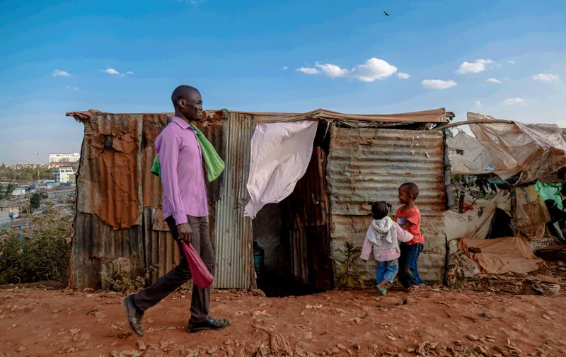 A man walks past children playing by the street in Kibera Slum of Nairobi, Kenya. Life inside Kibera Africa's Largest Slum.
Life inside Kibera Slum in Nairobi, Kenya,Image: 710310033, License: Rights-managed, Restrictions: , Model Release: no