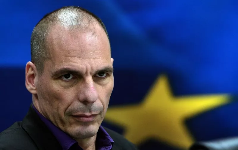 Greek Finance Minister Yanis Varoufakis arrives to present his ministry's new secretaries at a press conference in Athens on March 4, 2015. Strapped for cash and under pressure to deliver on reforms, Greece's new radical government has ruffled feathers in Brussels by not respecting the diplomatic niceties of the negotiating table..   AFP PHOTO/LOUISA GOULIAMAKI