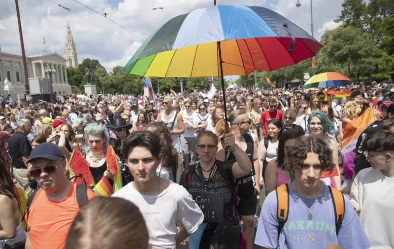 Participants of the "Rainbow Parade" (Pride Parade) on the Ringstrasse in Vienna on June 17, 2023. (Photo by Alex HALADA / AFP)