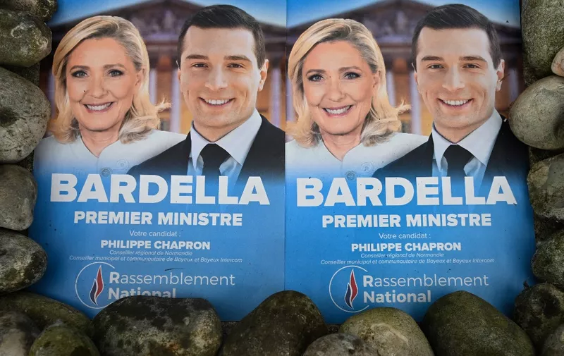 BAYEUX, FRANCE - JULY 03: 
An illustrative photo of two National Rally electoral posters with images of Marine Le Pen, President of the National Rally group in the National Assembly, and Jordan Bardella, President of the National Rally, seen ahead of the second round of the 2024 legislative election, on July 03, 2024, in Bayeux, Normandy, France.
Over 210 left-wing and Macronist candidates have withdrawn from the runoff round of the legislative elections, with the support of the French president, to block the far right from gaining power. (Photo by Artur Widak/NurPhoto) (Photo by Artur Widak / NurPhoto / NurPhoto via AFP)