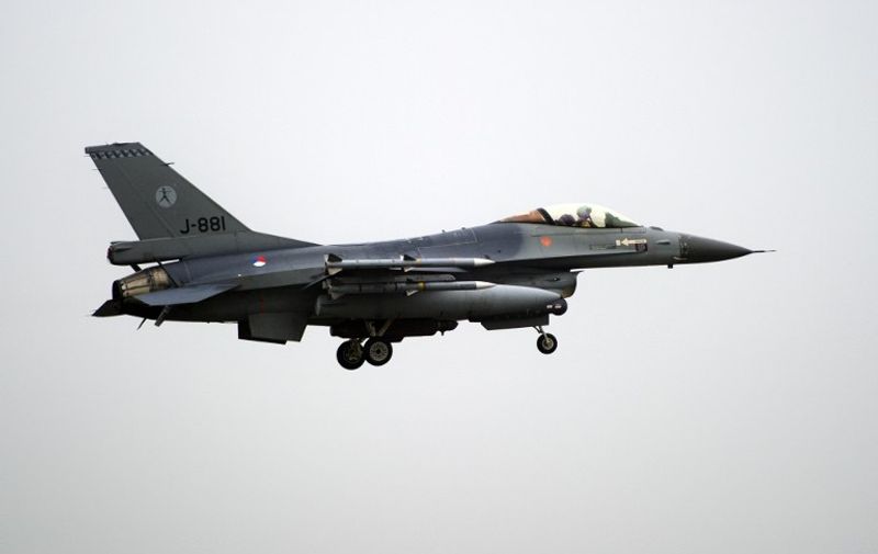 Dutch airforce F-16s return from their mission in Libya to the airbase in Leeuwarden,  Netherlands, on November 2, 2011. The F-16's were there since March 2011. AFP PHOTO/MARCEL ANTONISSE netherlands out - belgium out / AFP / ANP / MARCEL ANTONISSE