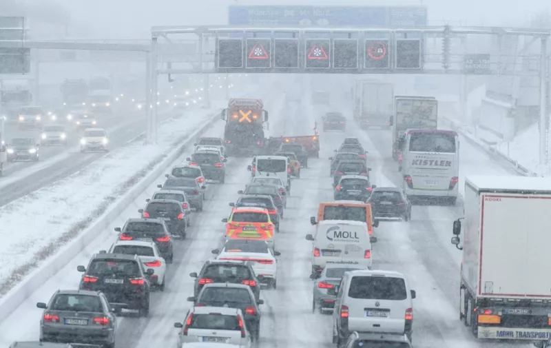 Cars stuck in a jam on the A9 highway in Garching, southern Germany, during heavy snowfall on January 9, 2019. (Photo by Matthias Balk / dpa / AFP) / Germany OUT