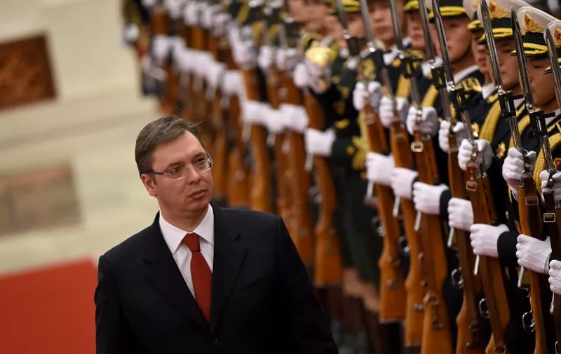 Serbian Prime Minister Aleksandar Vucic and Chinese Premier Li Keqiang (not in picture) inspect Chinese honour guards during a welcoming ceremony at the Great Hall of the People in Beijing on November 26,2015.  Vucic is on a visit to China from November 23 to 28. AFP PHOTO / WANG ZHAO / AFP / WANG ZHAO