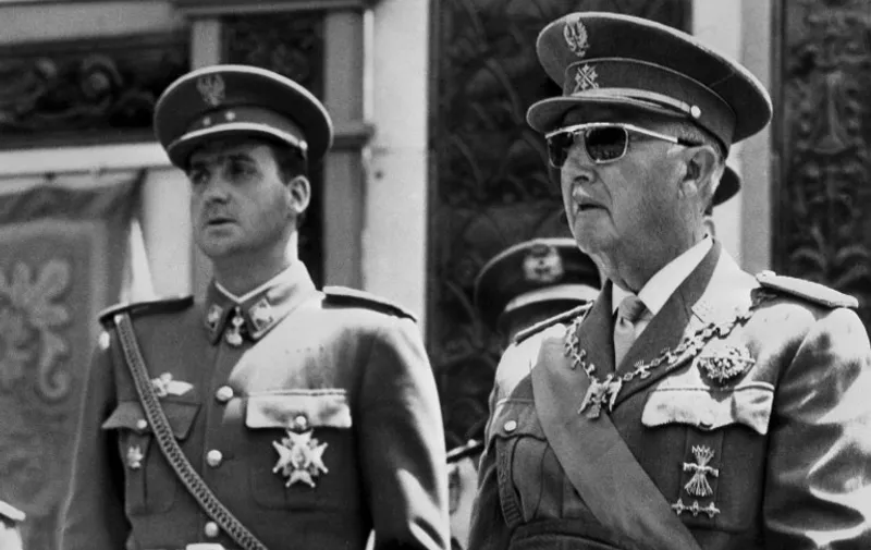 Prince Juan Carlos of Spain (L) (Juan Carlos Alfonso Víctor María de Borbón y Borbón) and Spain Caudillo General Francisco Franco pictured in 1996 In Madrid. Juan Carlos's grandfather Alfonso XIII was King of Spain until deposed in 1931 by the Second Spanish Republic. The Republic was ended by the Spanish Civil War and followed by the dictatorship of Franco, who ruled until his death 20 November 1975. Juan Carlos was designated King of Spain 22 November 1975. / AFP PHOTO