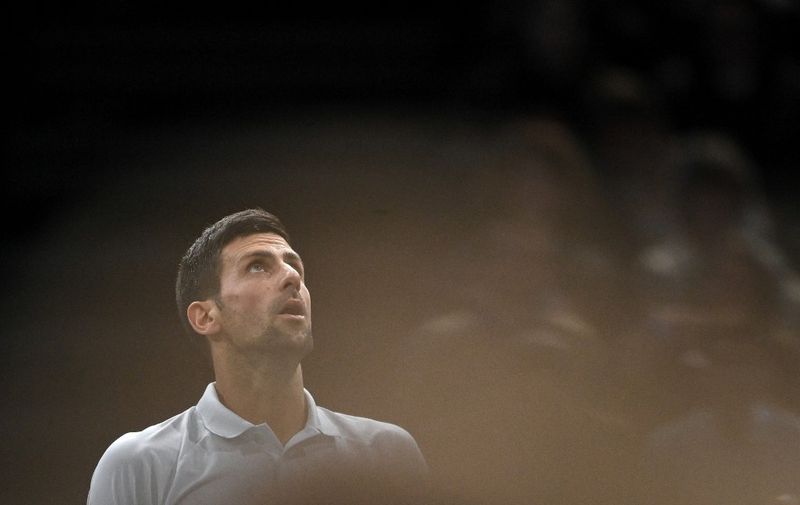 Serbia's Novak Djokovic looks on as he plays against US' Taylor Fritz during their men's singles quarter-final tennis match on day five of the ATP Paris Masters at The AccorHotels Arena in Paris on November 5, 2021. (Photo by Anne-Christine POUJOULAT / AFP)