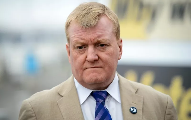 Former Liberal Democrat party leader Charles Kennedy speaks to the media at a "Better Together" campaign poster launch in Glasgow, Scotland on September 16, 2014. The leaders of Britain's three main parties on Tuesday issued a joint pledge to give the Scottish parliament more powers if voters reject independence, in a final drive to stop the United Kingdom from splitting. AFP PHOTO/LEON NEAL
