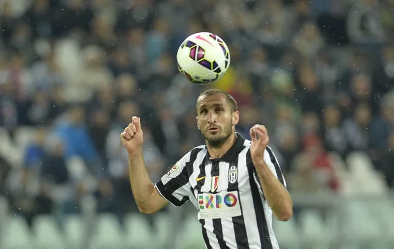 Juventus' defender Giorgio Chiellini heads the ball during the Italian Serie A football match between Juventus and Fiorentina on April 29, 2015 at Turin's Olympic stadium. AFP PHOTO / ANDREAS SOLARO