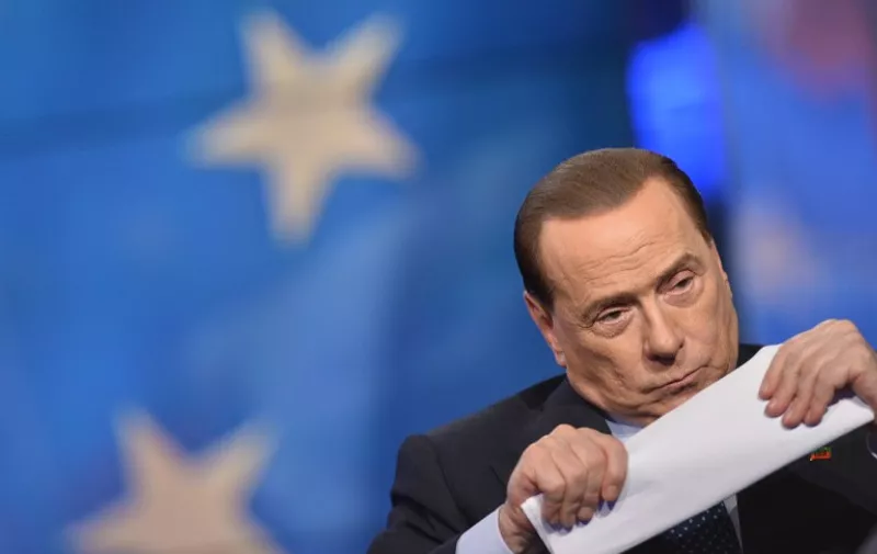 Italian former Prime Minister Silvio Berlusconi attends the "Porta a Porta" TV show at the Rai 1 headquarters on May 22, 2014 in Rome.  AFP PHOTO / TIZIANA FABI