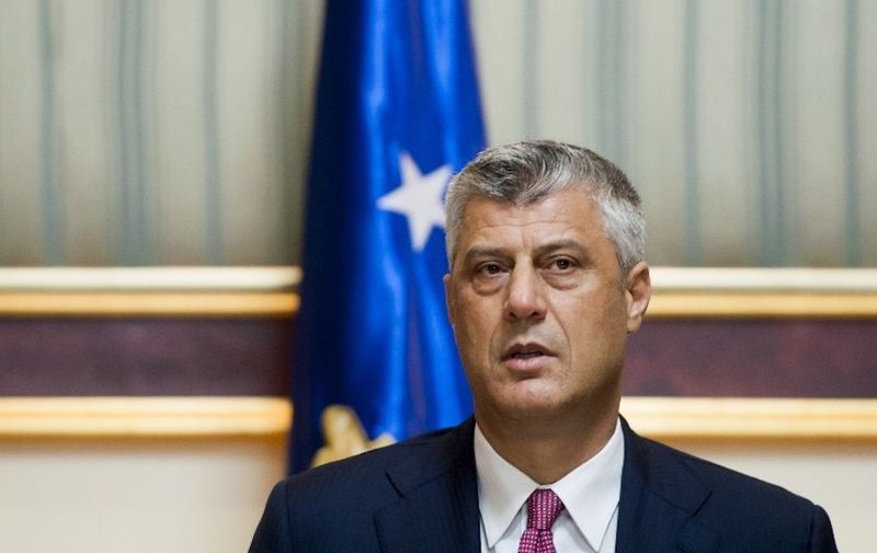 The head of the Democratic Party of Kosovo (PDK), Hashim Thaci,  addresses the media after signing a coalition agreement in Pristina on December 8, 2014. The two major Kosovo political parties on December 8 reached a deal on forming a government and ending a six-month political stalemate that has blocked the former Serbian province since June snap elections.   AFP PHOTO / ARMEND NIMANI