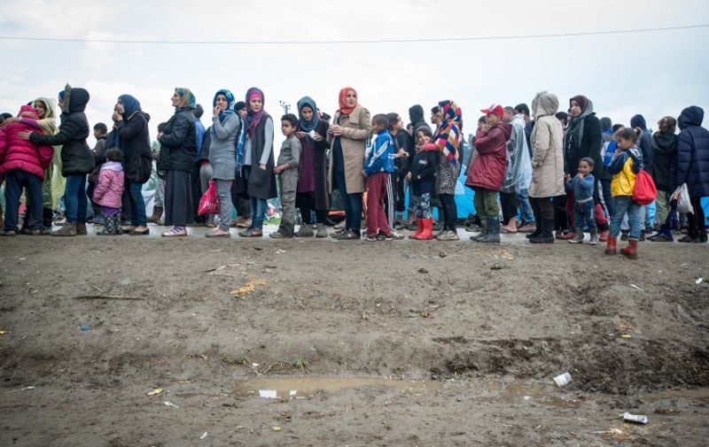 Migrants and refugees at makeshift camp in the northern border village of Idomeni, Greece, on April 9, 2016. Four migrant women and a child drowned on April 9 off the Greek island of Samos in the first deaths in the Aegean Sea since a controversial EU-Turkey deal took effect three weeks ago. (Photo by Guillaume Pinon/NurPhoto)