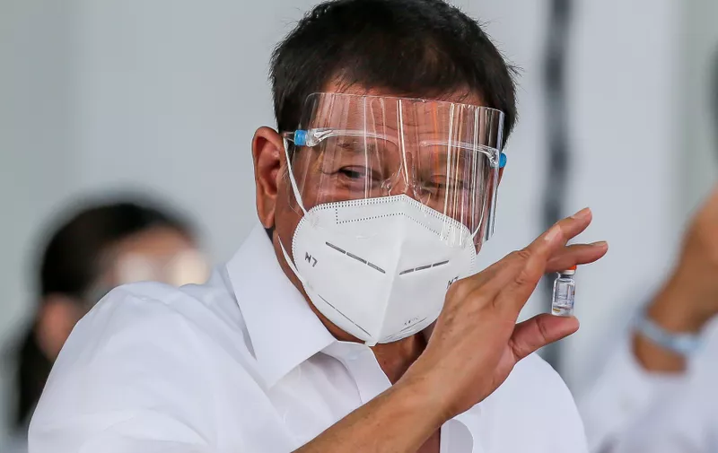 (210301) -- BEIJING, March 1, 2021 (Xinhua) -- Philippine President Rodrigo Duterte shows a vial of the Sinovac vaccine CoronaVac donated by China in Manila, the Philippines, on Feb. 28, 2021.
  A batch of Sinovac vaccine CoronaVac donated by China arrived in the Philippines on Sunday, the first COVID-19 vaccine to reach the Southeast Asian country.,Image: 594101015, License: Rights-managed, Restrictions: , Model Release: no, Credit line: Profimedia