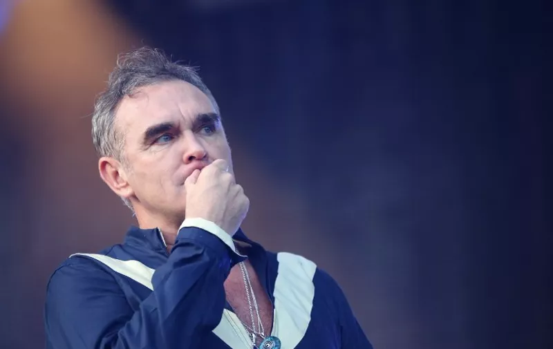 Morrissey performs at the Firefly Music Festival in Dover, Delaware, on June 19, 2015. The outspoken English singer performed a range of songs from his career including both new songs and the classics from The Smiths, including the vegetarian anthem "Meat is Murder." The sold-out, four-day event has been growing as it seeks to become the US East Coast's major summer music festival. AFP PHOTO/SHAUN TANDON / AFP / SHAUN TANDON