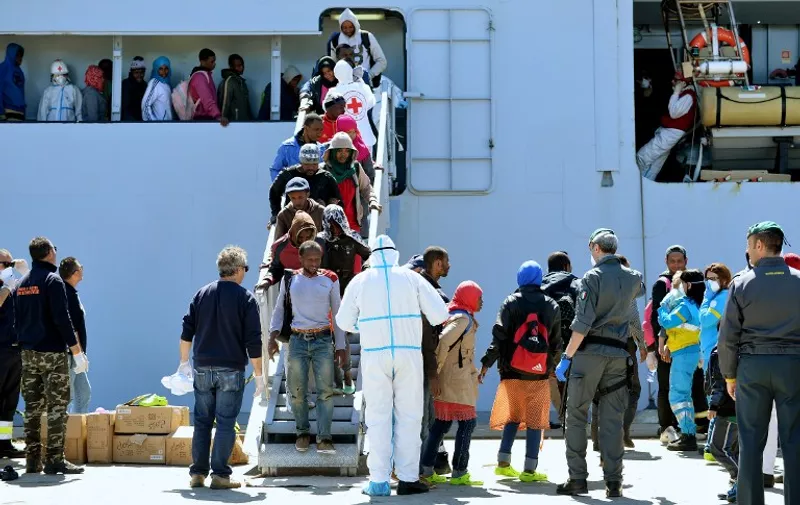 Rescued migrants disembark from the Italian Navy vessel Bettica after arriving in the Sicilian harbour of Augusta on April 22, 2015 . European governments came under increasing pressure to tackle the Mediterranean&#8217;s migrant crisis ahead of an emergency summit, as harrowing details emerged of the fate of hundreds who died in the latest tragedy. AFP [&hellip;]