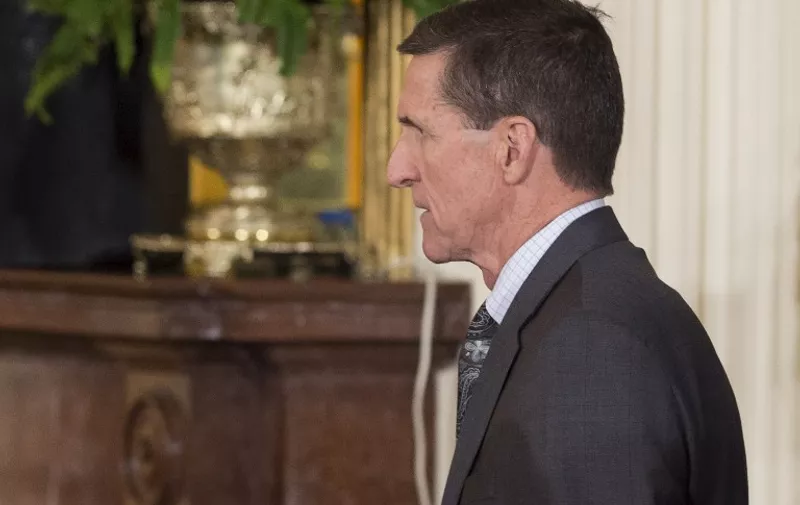 National Security Advisor Michael Flynn arrives for a press conference between US President Donald Trump and Canadian Prime Minister Justin Trudeau in the East Room of the White House in Washington, DC, February 13, 2017.
The White House announced February 13, 2017 that Michael Flynn has resigned as President Donald Trump's national security advisor, amid escalating controversy over his contacts with Moscow. In his formal resignation letter, Flynn acknowledged that in the period leading up to Trump's inauguration: "I inadvertently briefed the vice president-elect and others with incomplete information regarding my phone calls with the Russian ambassador." / AFP PHOTO / SAUL LOEB