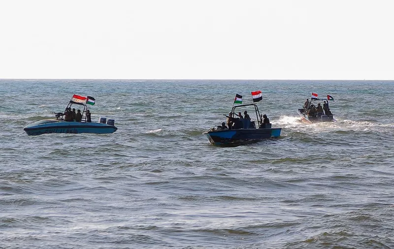 Members of the Yemeni Coast Guard affiliated with the Houthi group patrol the sea as demonstrators march through the Red Sea port city of Hodeida in solidarity with the people of Gaza on January 4, 2024, amid the ongoing battles between Israel and the militant Hamas group in Gaza. (Photo by AFP)
