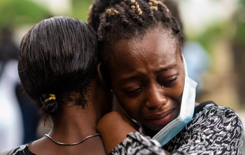 (210822) -- LES CAYES, Aug. 22, 2021 (Xinhua) -- A woman cries when attending a funeral of her relative died of the earthquake in Marceline, near Les Cayes, Haiti, on Aug. 21, 2021.,Image: 628301945, License: Rights-managed, Restrictions: , Model Release: no, Credit line: Profimedia