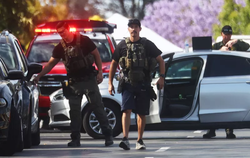 LAGUNA WOODS, CALIFORNIA - MAY 15: Police investigate the scene of a shooting at the Geneva Presbyterian Church on May 15, 2022 in Laguna Woods, California. According to police, the shooting left one person dead, four critically wounded, and one with minor injuries.   Mario Tama/Getty Images/AFP (Photo by MARIO TAMA / GETTY IMAGES NORTH AMERICA / Getty Images via AFP)