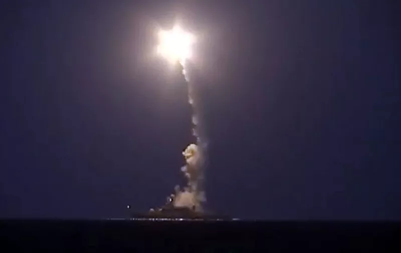 CORRECTION-LOCATION IN THE METADATA
An image grab made from a video released by the Russian Defence Ministry on October 7, 2015 reportedly shows a Russian warship launching a cruise missile in the Caspian Sea during a strike against Islamic State (IS) group's positions in Syria. Russian warships joined in strikes in Syria with a volley of cruise missile attacks on October 7 as Russian President Vladimir Putin pledged his air force would back a ground offensive by government forces. AFP PHOTO / HO / RUSSIAN DEFENCE MINISTRY 
RESTRICTED TO EDITORIAL USE - MANDATORY CREDIT " AFP PHOTO / RUSSIAN DEFENCE MINISTRY" - NO MARKETING NO ADVERTISING CAMPAIGNS - DISTRIBUTED AS A SERVICE TO CLIENTS