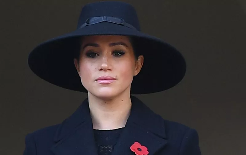 (FILES) In this file photo taken on November 10, 2019 Britain's Meghan, Duchess of Sussex looks on from a balcony as she attends the Remembrance Sunday ceremony at the Cenotaph on Whitehall in central London, on November 10, 2019. - Meghan Markle has revealed she suffered a miscarriage in July this year, writing in the New York Times on November 25, 2020 of the deep grief and loss she endured with her husband Prince Harry. (Photo by Daniel LEAL-OLIVAS / AFP)