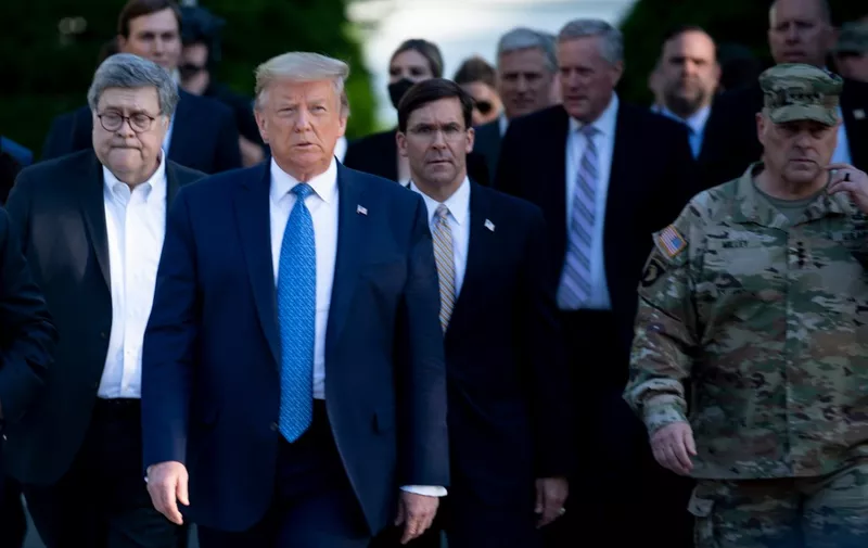 (FILES) In this file photo taken on June 01, 2020, US President Donald Trump walks with US Attorney General William Barr (L), US Secretary of Defense Mark  Esper (C), Chairman of the Joint Chiefs of Staff Mark Milley (R), from the White House to visit St. John's Church after the area was cleared of people protesting the death of George Floyd, in Washington, DC. - Milley said on June 11, 2020, he was wrong to join President Donald Trump on a walk across a park violently cleared of protesters for a photo opportunity near the White House. "I should not have been there. My presence in that moment and in that environment created a perception of military involvement in domestic politics," Milley said of the controversial June 1 incident. (Photo by Brendan Smialowski / AFP)