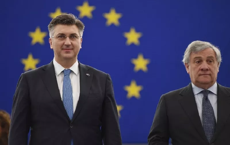 Croatia's Prime Minister Andrej Plenkovic (L) is welcomes by President of the European Parliament Antonio Tajani during a plenary session in the European Parliament on February 6, 2018 in Strasbourg, eastern France. (Photo by FREDERICK FLORIN / AFP)