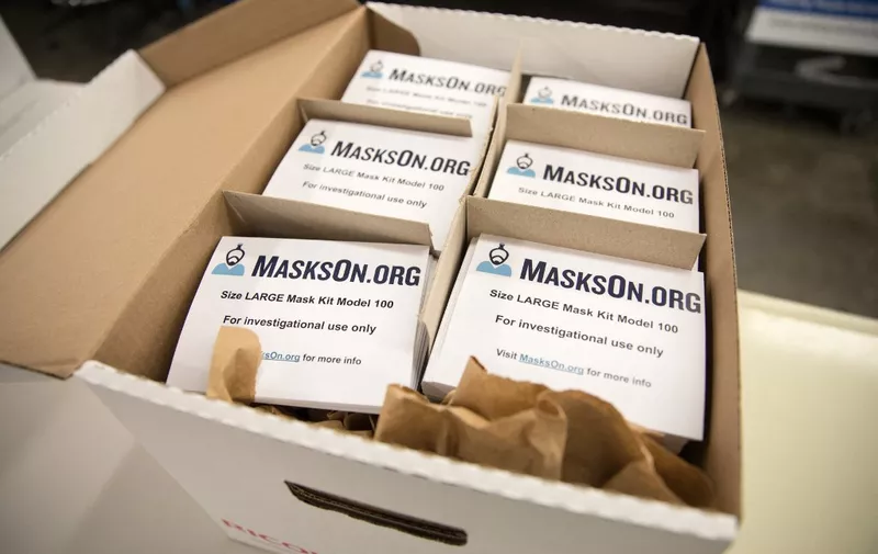 HAVERHILL, MA - APRIL 16: A box of modified scuba masks equipped with custom-made air supply adapters is ready to be shipped on April 16, 2020 in Haverhill, Massachusetts. MasksOn.org designed an adapter that permits the masks to use a medical facility's air supply. The organization supplies them free of charge to clinicians who do not have access to FDA-approved personal protection equipment. MasksOn.org is a consortium of engineers affiliated with Google, MIT and Yale who designed the modifications in the midst of the COVID-19 pandemic.   Scott Eisen/Getty Images/AFP (Photo by Scott Eisen / GETTY IMAGES NORTH AMERICA / Getty Images via AFP)