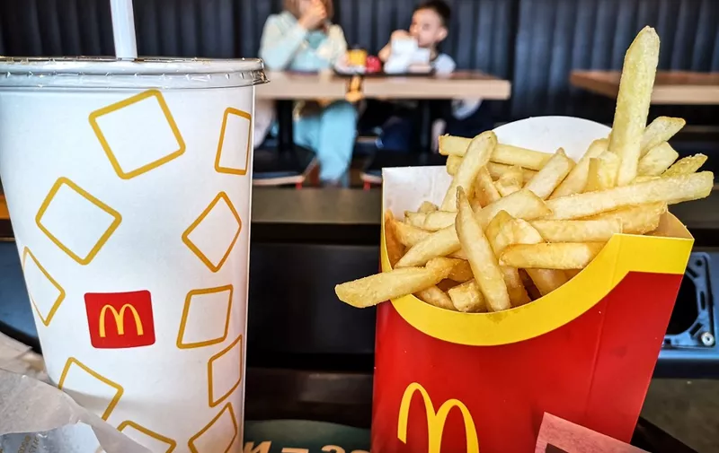People have a lunch in a McDonald's restaurant in Moscow on March 9, 2022. - Major brands have continued to pull out of Russia, with McDonald's, Coca-Cola, Starbucks and Heineken among the latest to join the international chorus of outrage. (Photo by AFP)