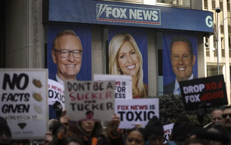 (FILES) In this file photo taken on March 13, 2019 protesters rally against Fox News outside the Fox News headquarters at the News Corporation building in New York City. - A closely-watched civil trial that pits vote machine maker Dominion against Fox News and tests the extent of free speech rights for media in America -- even when broadcasting alleged election falsehoods -- is due to start Thursday, April 13, 2023 with jury selection.
The proceedings could be one of the most consequential defamation cases ever heard in the United States and threaten financial and reputational damage for Rupert Murdoch's conservative TV network. (Photo by Drew ANGERER / GETTY IMAGES NORTH AMERICA / AFP)